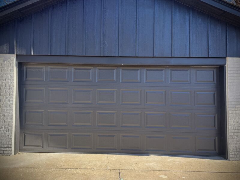 After: Dented double door replaced with a new navy door